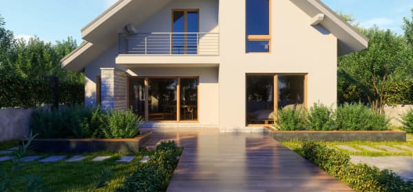 Frontansicht eines modernen Einfamilienhauses mit Garten