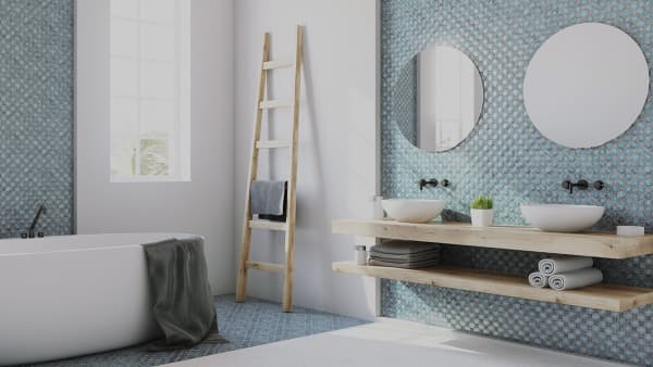 Badezimmer mit Wanne und zwei Waschbecken.