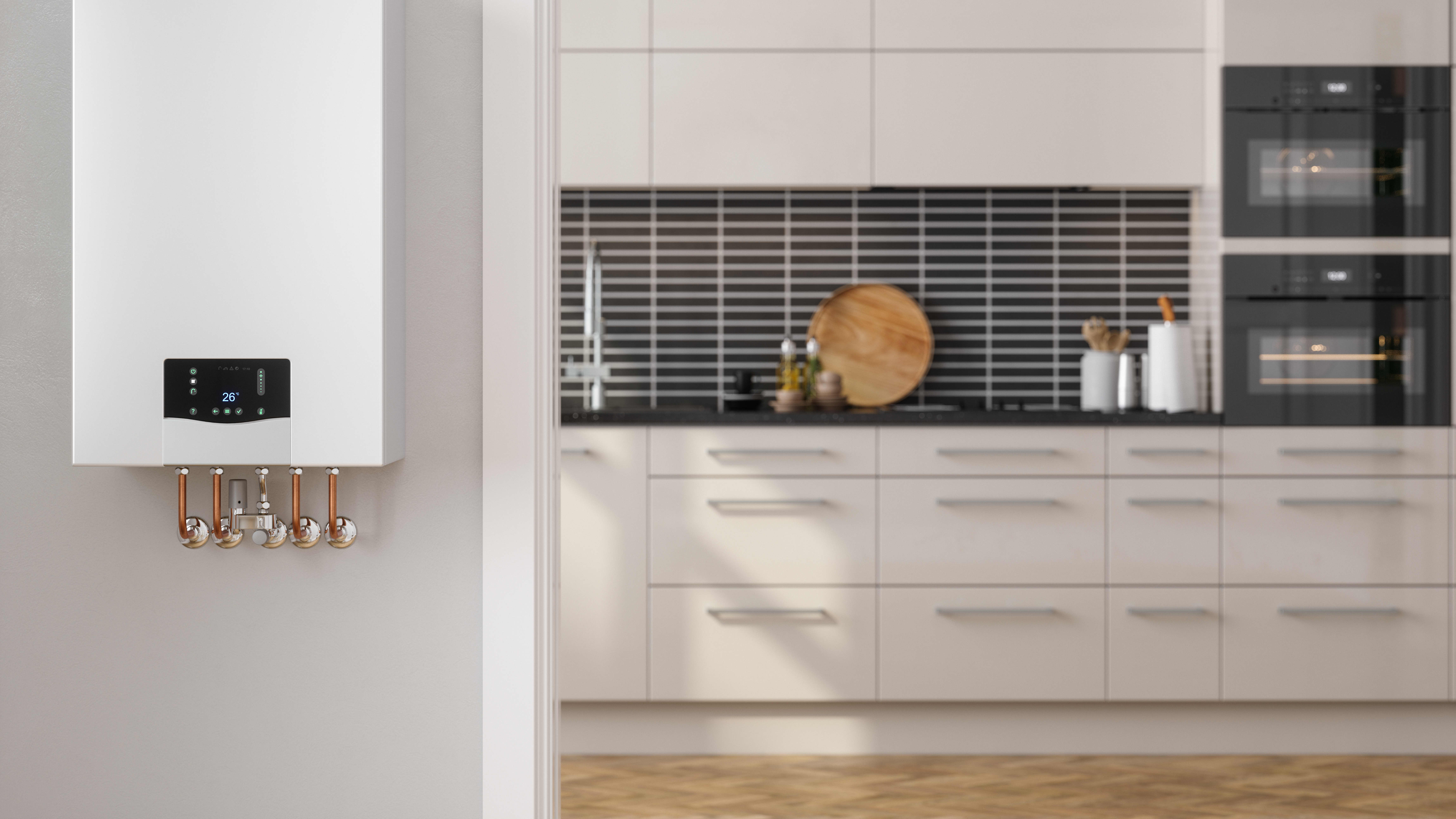 Moderne Gastherme mit weißer Küchenzeile im Hintergrund