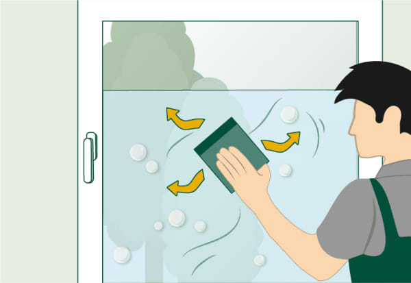 Die Grafik zeigt das Entfernen von Luftblasen unter Fensterfolie